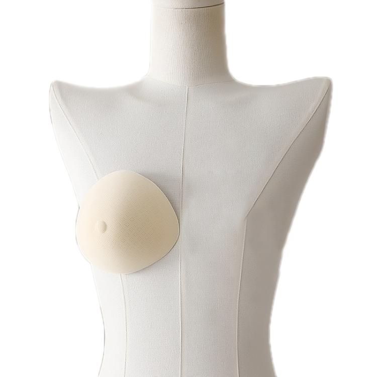 Non-adhesive post-mastectomy bra with one beige prosthetic breast pad on mannequin