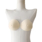 Non-adhesive post-mastectomy bra with two beige prosthetic breast pads on mannequin