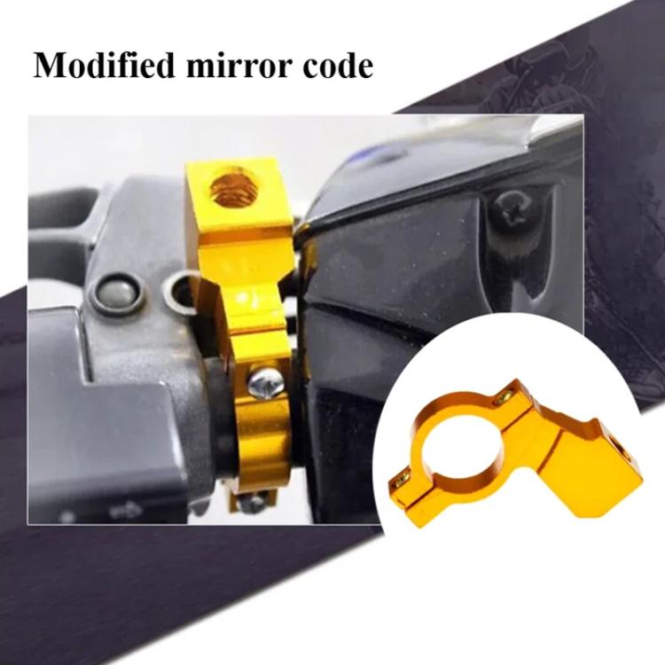 Yellow motorcycle mirror bracket clamp mounted on a handlebar area