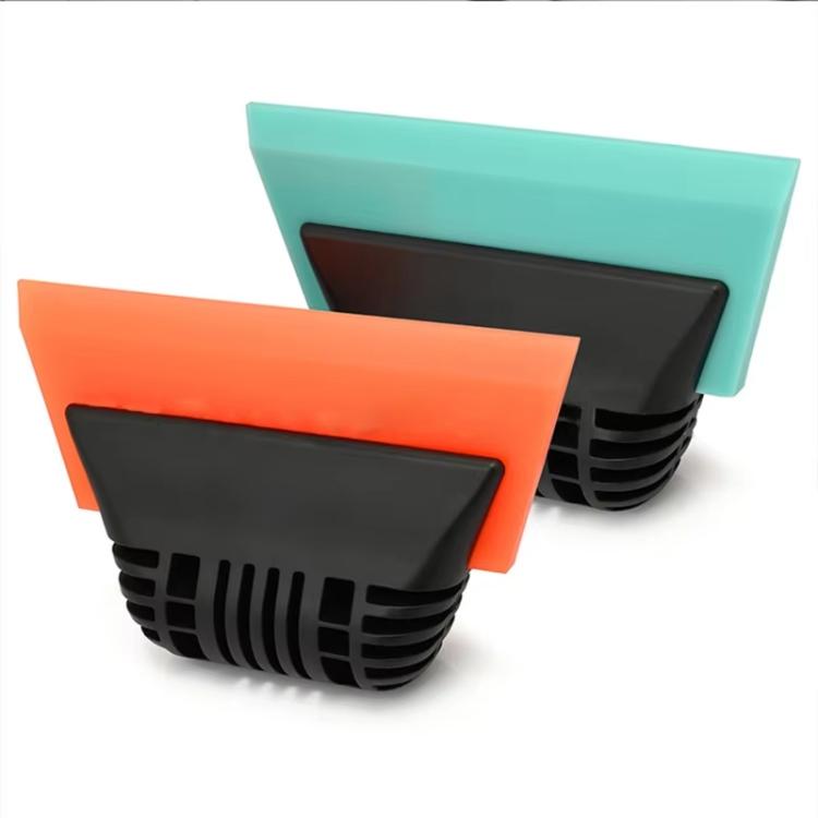 Tint scraper tool with black rubber blade and orange and teal backing pads