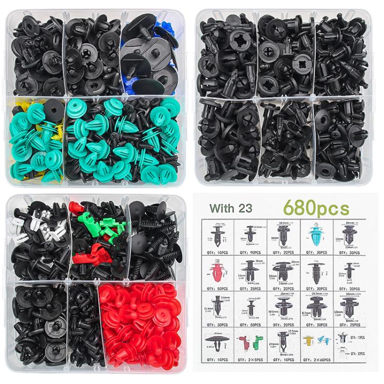 Assorted automotive retainer clips in compartments: black, teal, red, and green
