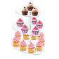 Three-tier heart-shaped acrylic cupcake stand displaying pink frosted cupcakes