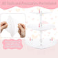 Three-tier heart-shaped acrylic cupcake stand with protective film being removed