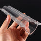 Transparent heart-shaped plastic mold for fruit shaping, shown in hand