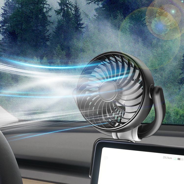 Black car corner fan on dashboard with airflow effect, circular front grille