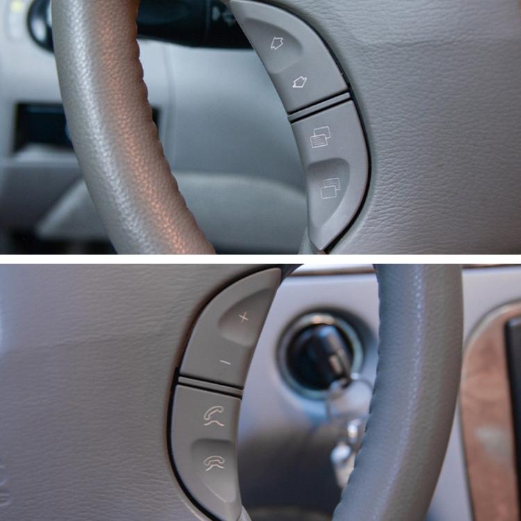 Installed steering wheel multi-function button covers with plus, minus and phone icons