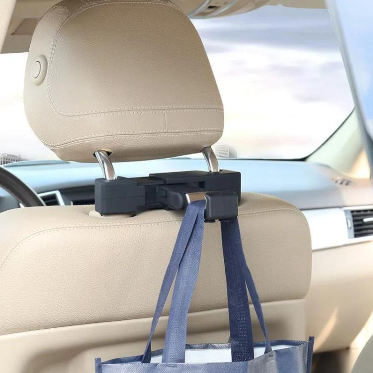 Car seatback hanging hook on a car headrest, with a tote bag hanging from it
