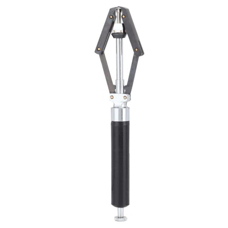 Watch needle remover tool with black handle and metal fork arms