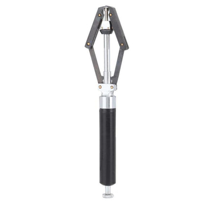 Watch needle remover tool with black handle and metal fork arms