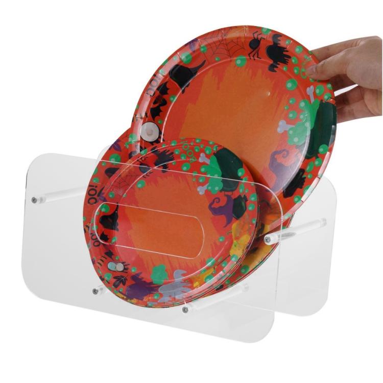 Acrylic plate display stand with a patterned plate placed in the holder by hand
