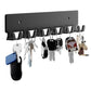 Black metal key wall hook rack with six hooks holding multiple keychains