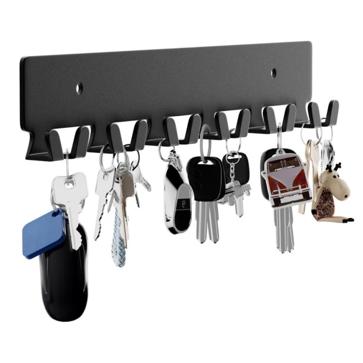 Black metal key wall hook rack with six hooks holding multiple keychains