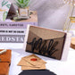Black metal mail letter storage rack with 'Mail' cutout, standing with envelopes on desk