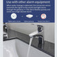Water leak detector sensor shown with siren alarm and faucet in kitchen setup