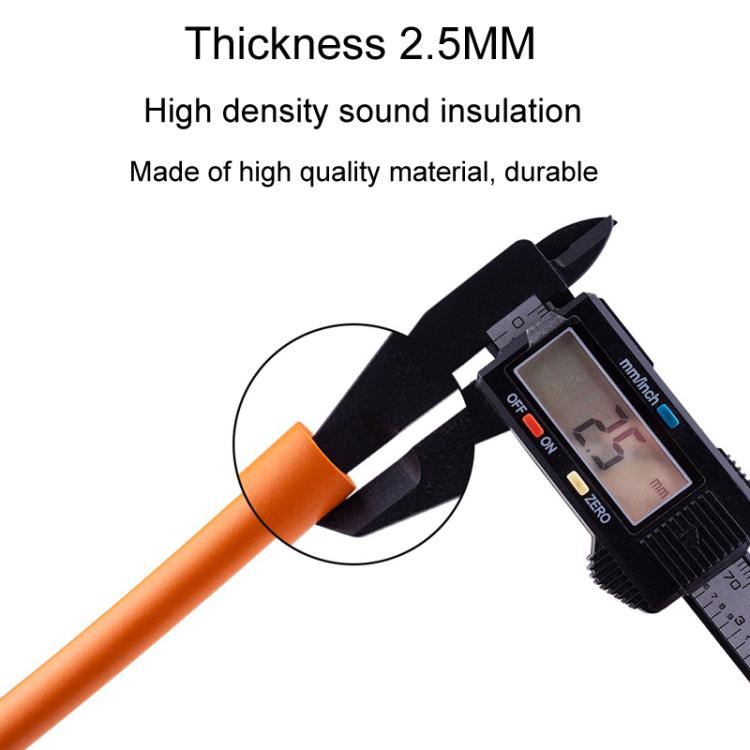 Orange foam anti-rattle bicycle cable tube in front of a measuring tool