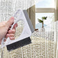 Window cleaning brush tool with white triangular frame and black bristles