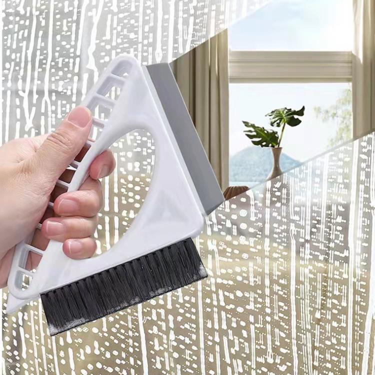 Window cleaning brush tool with white triangular frame and black bristles