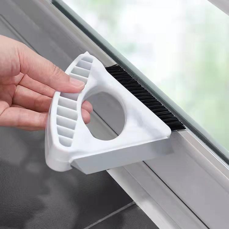 White window gap brush with black bristles and curved scraper for glass edges