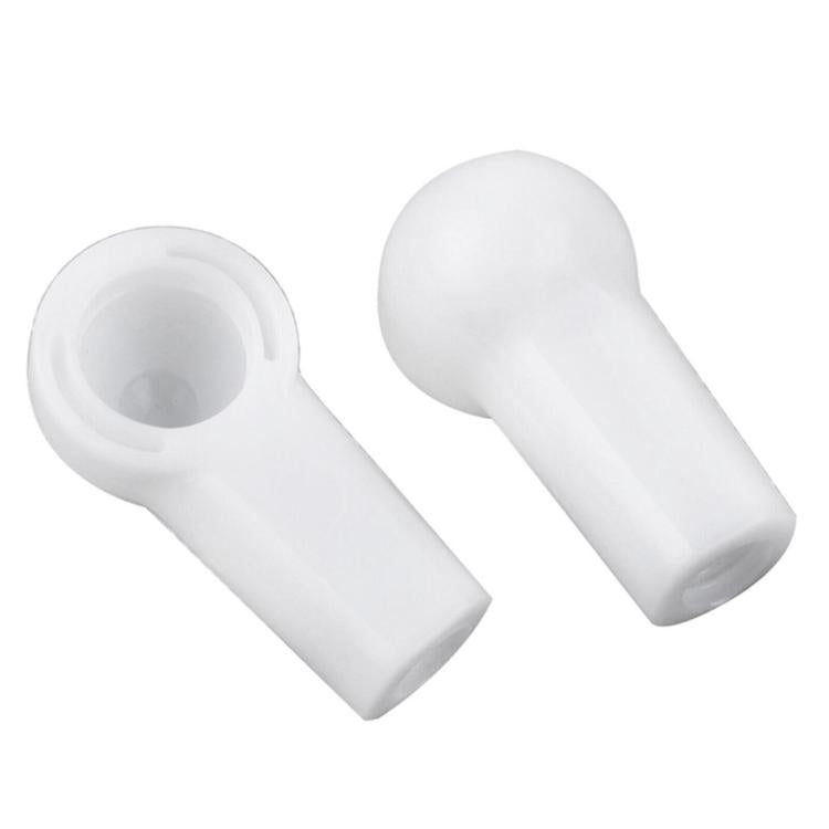 Pair of white convertible push rod bracket caps showing hollow circular interiors