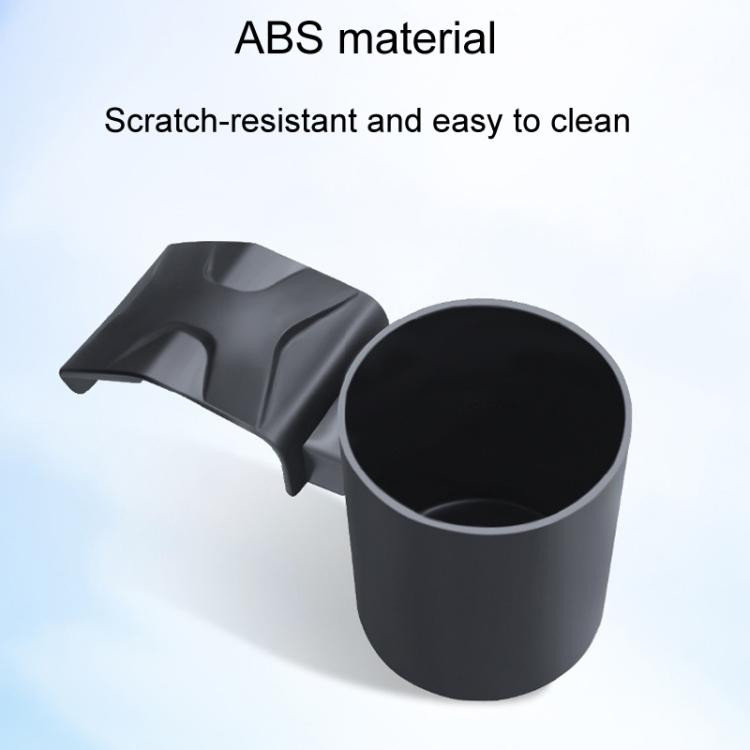 Car dashboard cup holder with angled base and large cylindrical storage cup