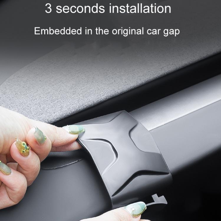 Car dashboard cup holder bracket being clipped into dashboard gap