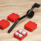 Heavy object moving tool with black wheel and handle, red square pads, roller pack included