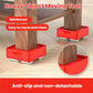 Heavy object moving tool under wooden block, showing red non-slip square base and wheel arm