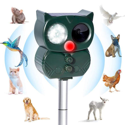 Solar-powered ultrasonic animal repeller, green cat-shaped unit with front light lens