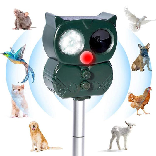Solar-powered ultrasonic animal repeller, green cat-shaped unit with front light lens