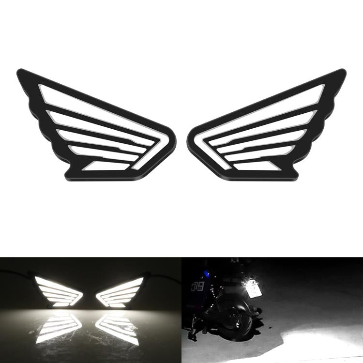 Pair of wing-shaped LED marker lights with white glowing stripes