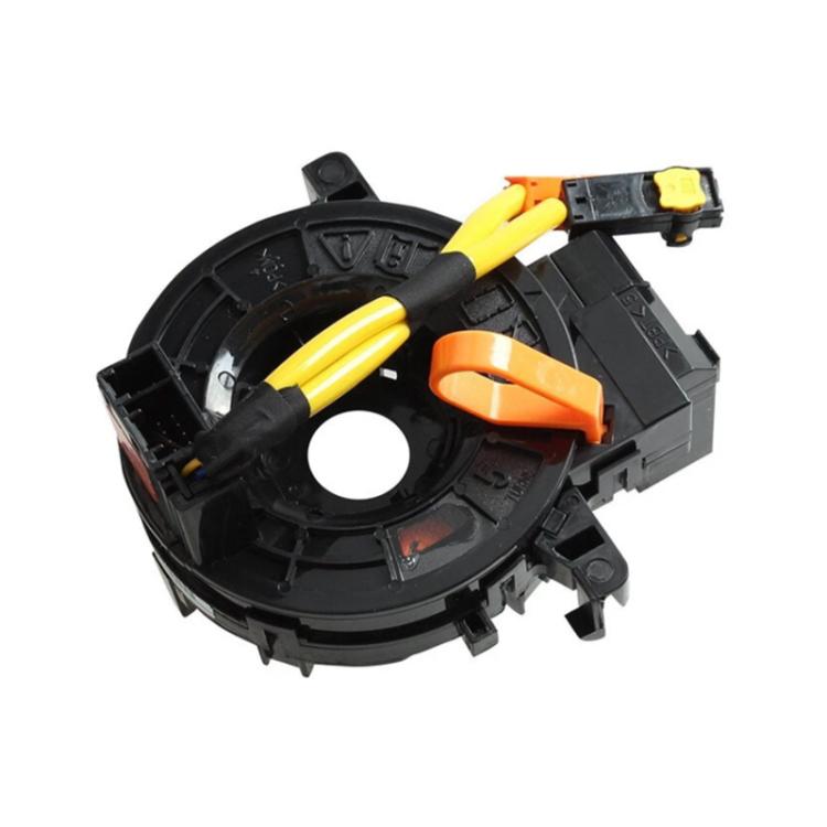 Automotive clock spring reel with yellow ribbon and orange connector blocks
