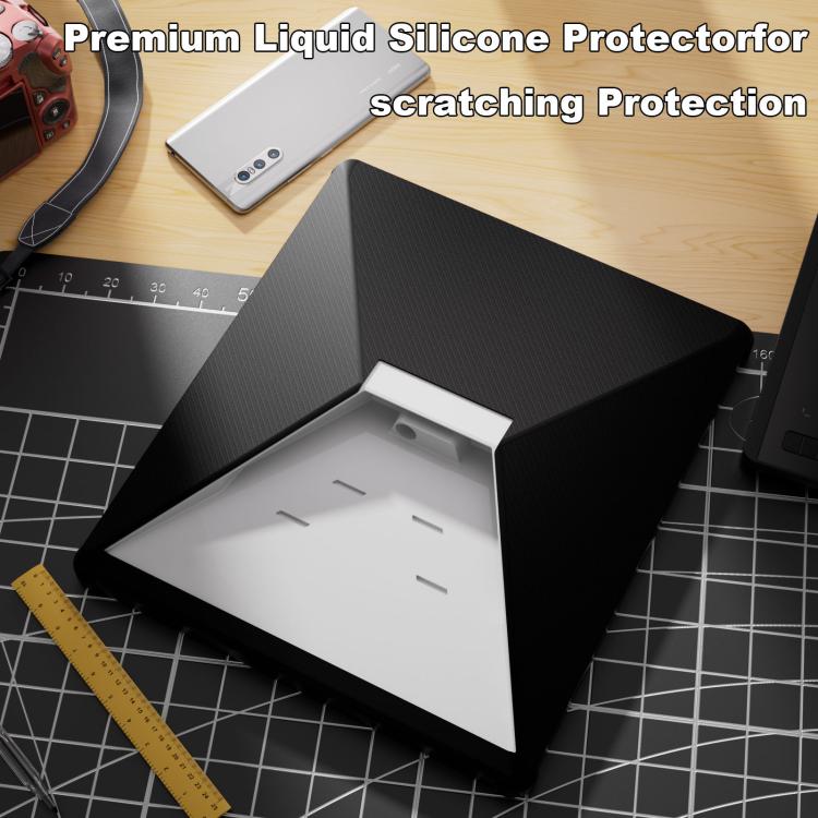 Black textured silicone protective cover with white insert on a cutting mat
