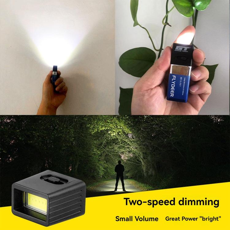 Handheld mini LED key flashlight emitting a bright beam