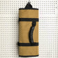 Tan rolled tool storage sleeve with black elastic bands and hanging loop