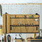 Tan wall-mounted tool organizer pouch with elastic tool loops and side pockets