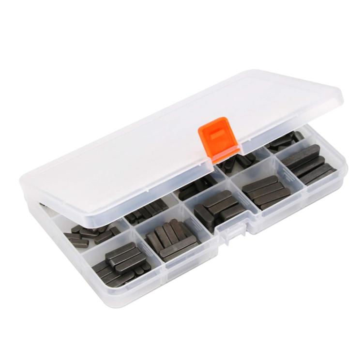 Boxed feather pin key set, clear case with orange latch and multiple dark pins