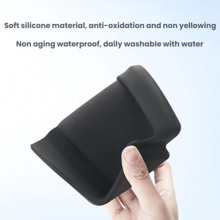 Fold-down armrest storage tray, dark matte black textured surface and side grip