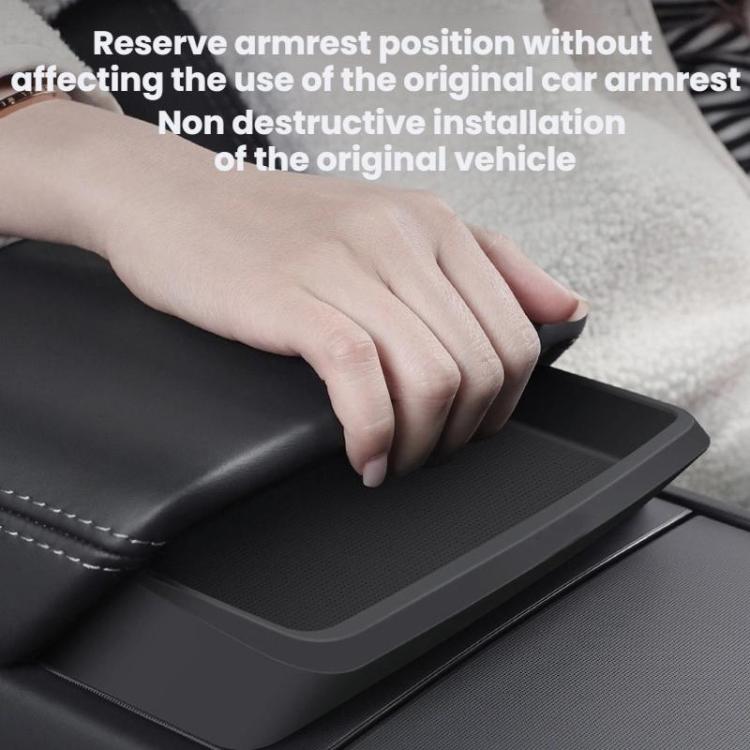Armrest storage tray being installed over center console, dark matte black