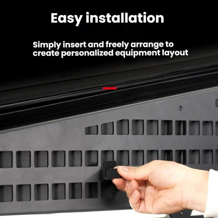 Hand installing black MOLLE trunk panel hook into rectangular slots