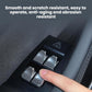 Window lift button sticker on black door trim with silver chrome switch covers