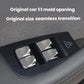 Window lift button stickers on car door switch area, silver covers in black panel