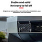 Black perforated license plate frame secured to vehicle grille with four corner bolts