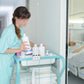 Medical room with bottles stored on a countertop three-hole bottle stand
