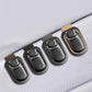 Set of car sun visor glasses holders with snap clips and stitched leather pads