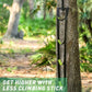 Outdoor black rope climbing ladder wrapped around a tree with neon green loop rungs