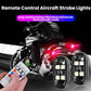 Pair of black remote-controlled LED strobe lights with a handheld color remote