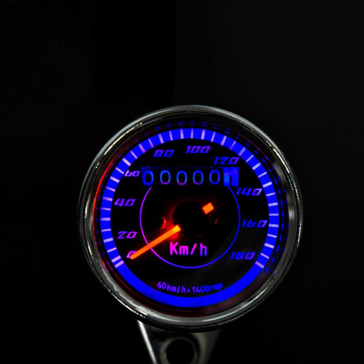 Motorcycle speedometer gauge with blue backlit dial, chrome bezel, km/h scale