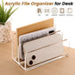 Clear acrylic file organizer with open front holding papers and a smartphone