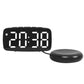 Black LED alarm clock with white light time display and round vibration base.
