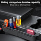 Black in-car retractable storage box mounted between seats with open side compartments